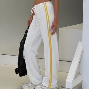 White Track Pants with Yellow/Gold Side Stripes